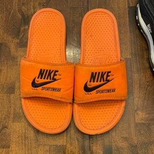 Orange Nike slides